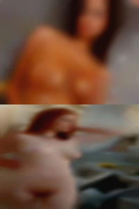 Placerville naked woman leaning over sex ads.